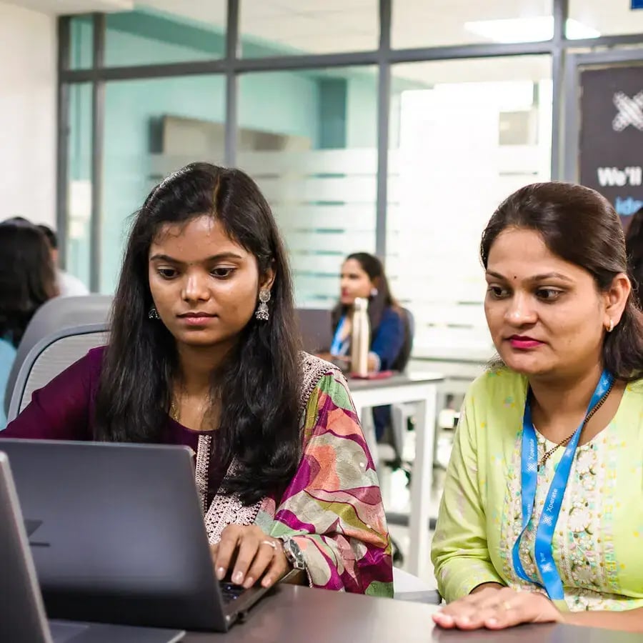 Two female staff members working together Two female staff members working together