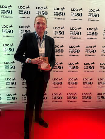 Simon with award