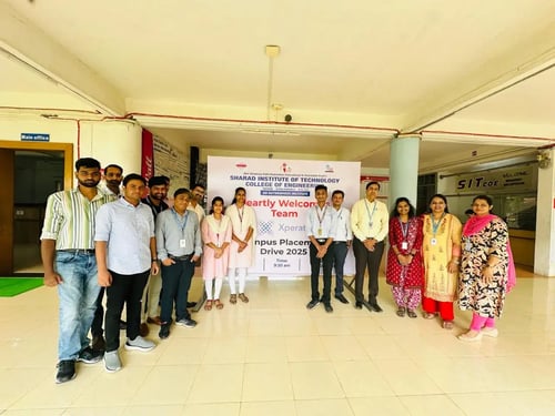 Team in front of banner