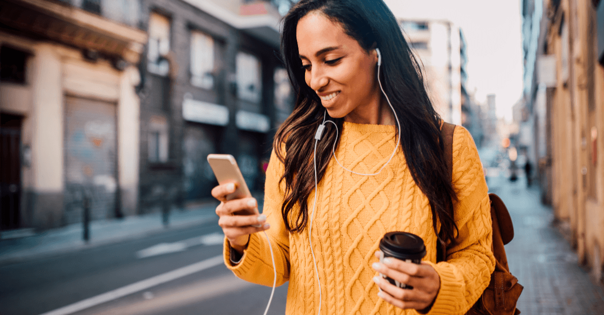 happy woman smiling at her phone